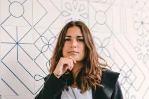 young woman with a questioning expression asking what is mindfulness