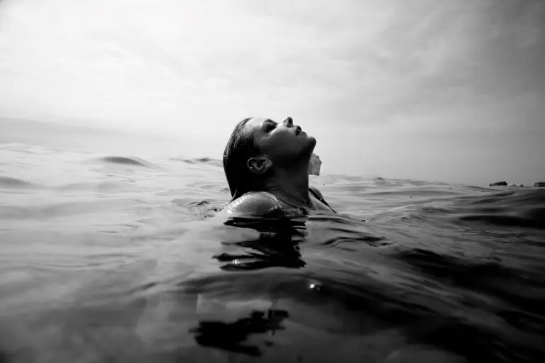woman using her respiratory system to take a breath