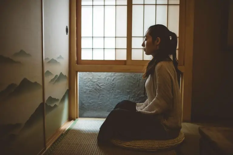 A woman practicing the heart of zen meditation