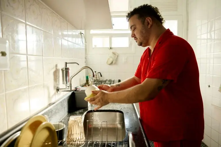 man washing up the dishes