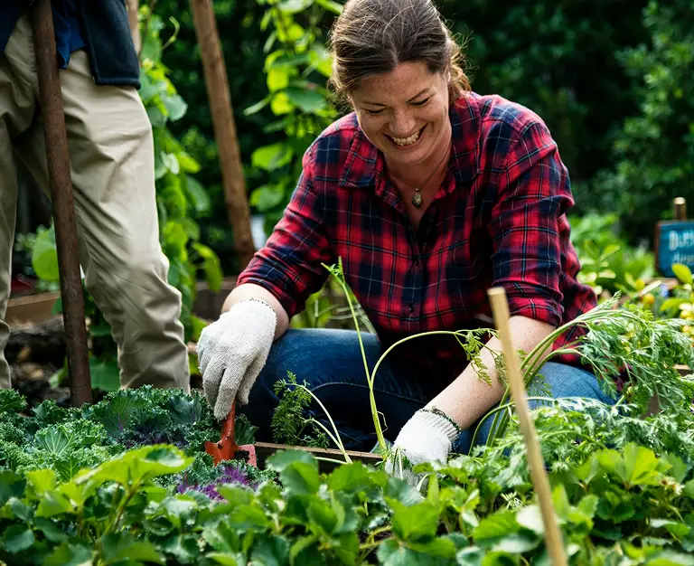 smiling woman gardening