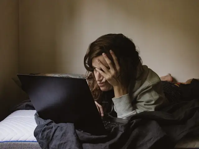 woman looking frustrated searching on a computer